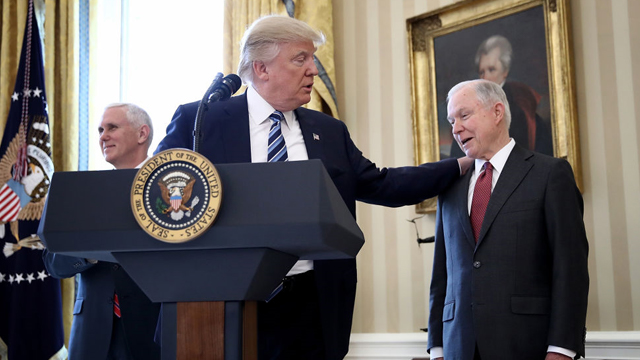 Jeff Sessions (right) was mocked by Rockstar in Red Dead Redemption 2. The Red Dead Redemption 2 Jeff Sessions easter egg is found in a newspaper article.
