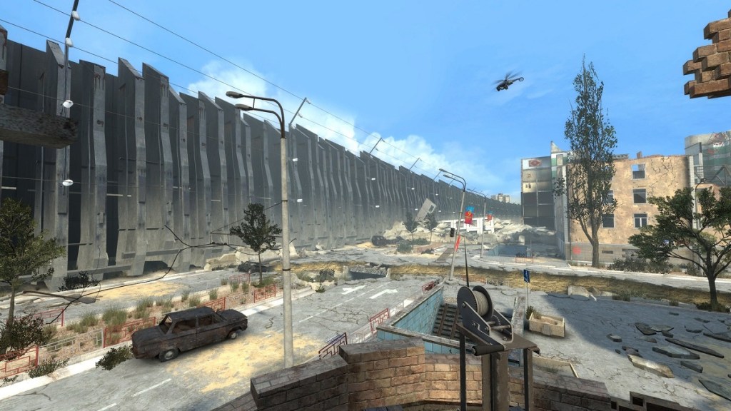 Half-Life 2 mod showing a dilapidated street surrounded by a huge wall.