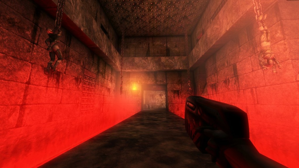 Unreal (1998): A dark corridor with a very red misty haze.