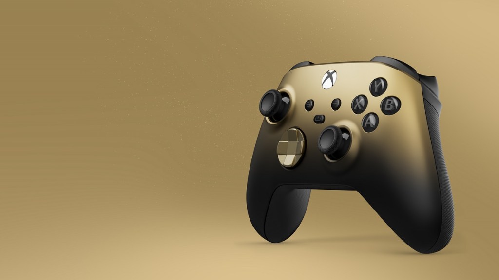 A gold Xbox controller on a gold background.
