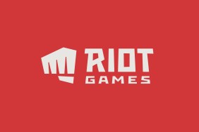 Riot Games "fist" logo on a bright, red background.