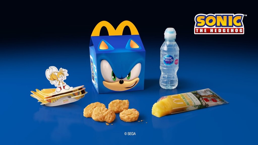 A Sonic the Hedgehog-themed Happy Meal box with McDonald's food placed around it.