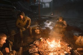 STALKER 2: soldiers sitting around a campfire at night.
