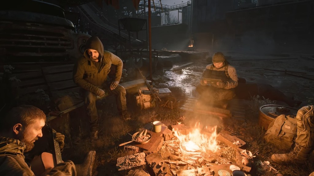 STALKER 2: soldiers sitting around a campfire at night.