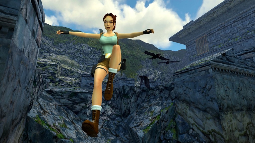 Tomb Raider Remastered: Lara Croft jumping down off a cliff.