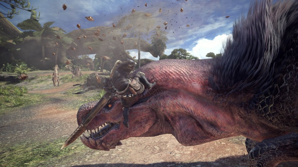 Monster Hunter World : un joueur grimpant sur la tête d'un monstre géant.