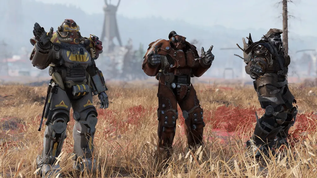 Fallout 76: three people in Brotherhood of Steel armor standing in a field.