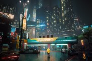 Cyberpunk 2077: a person in a yellow jacket looks insignificant against the neon buildings of Night City.