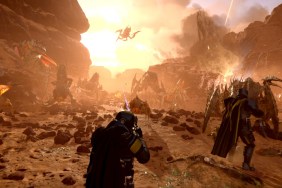 Helldivers 2: an orange-y haze as soldiers battle against large creatures.
